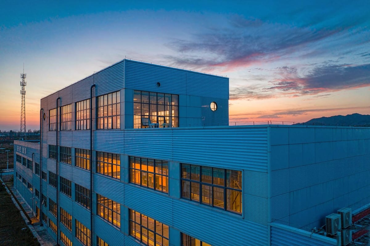 Steel workshop facade at night